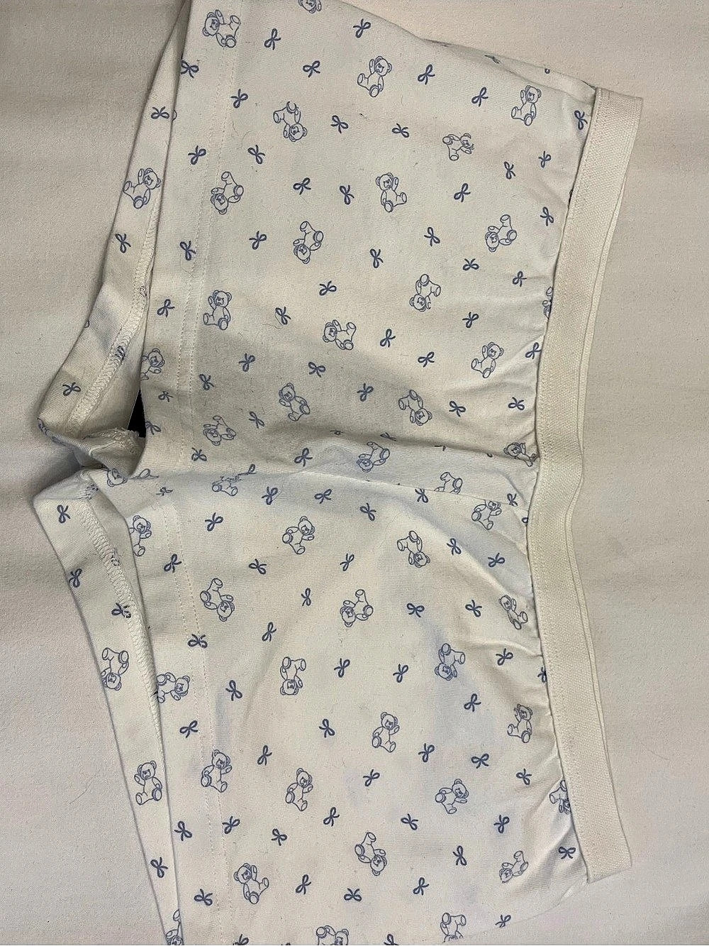 Brandy Melville white shorts with blue teddy bear and bows